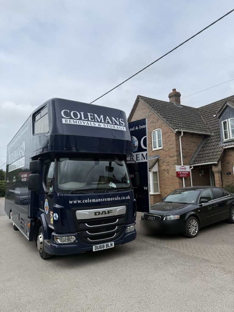 A Colemans crew loading a removals lorry